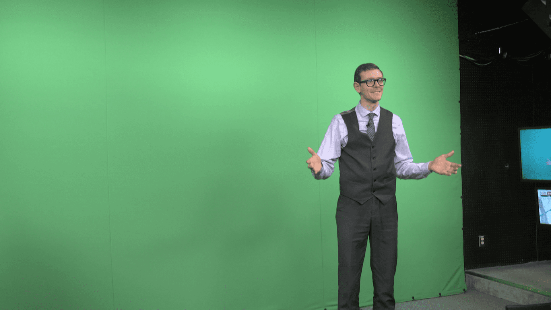 Brandon in front of a green screen