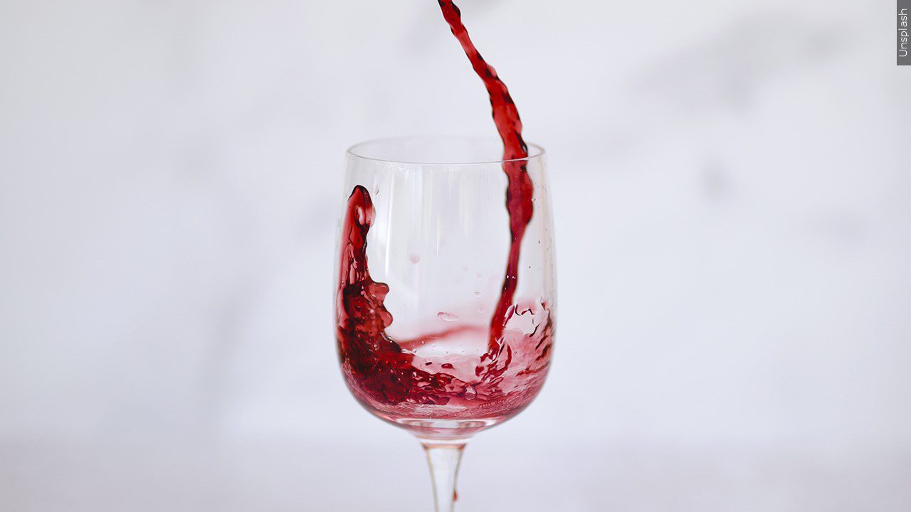 Red wine being poured into a glass