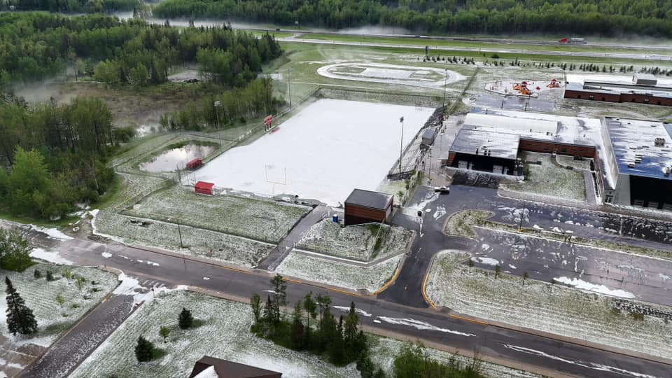 Accumulating hail covers the Mt. Iron football field.  Courtesy Dan Albert