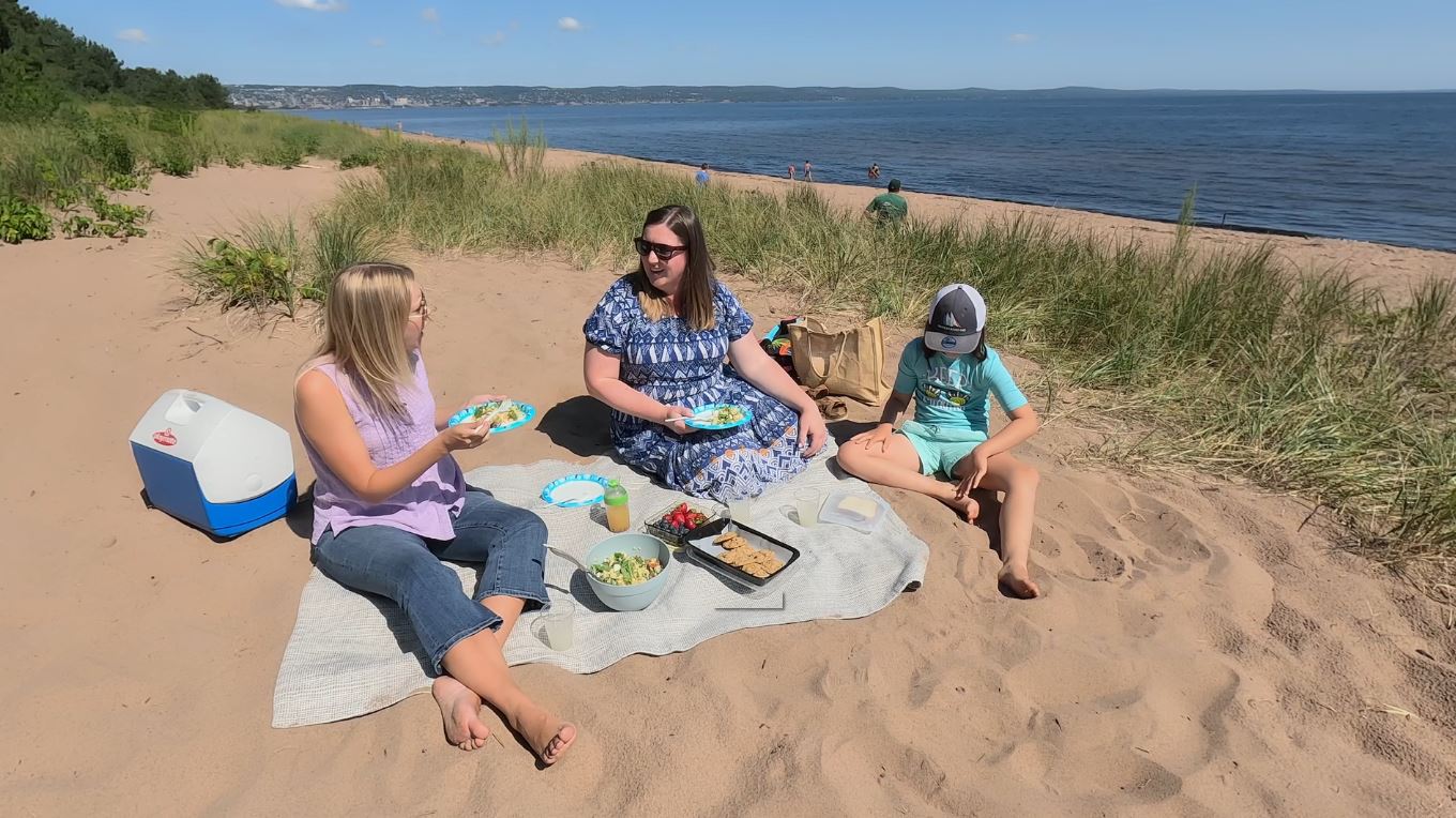 Baihly, Andrea, and Charlee have a picnic on Park Point