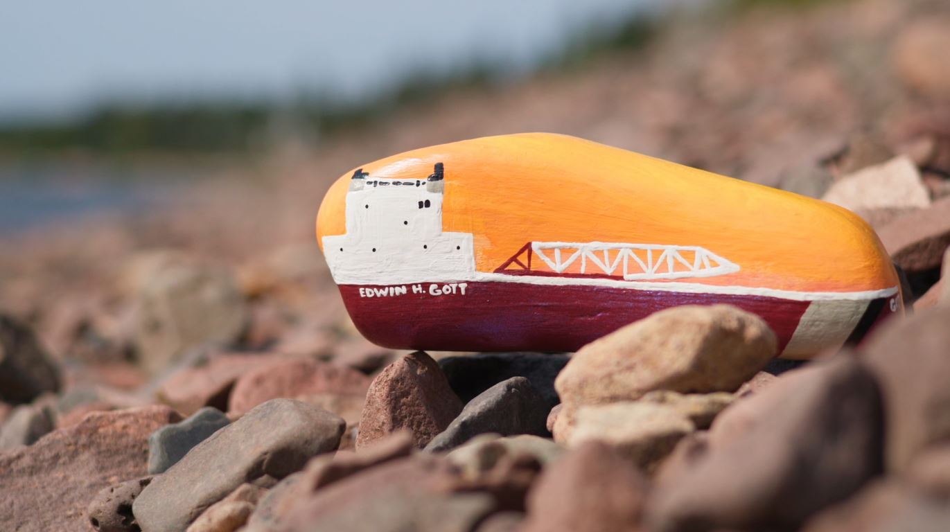 A painted rock showing the Edwin H. Gott