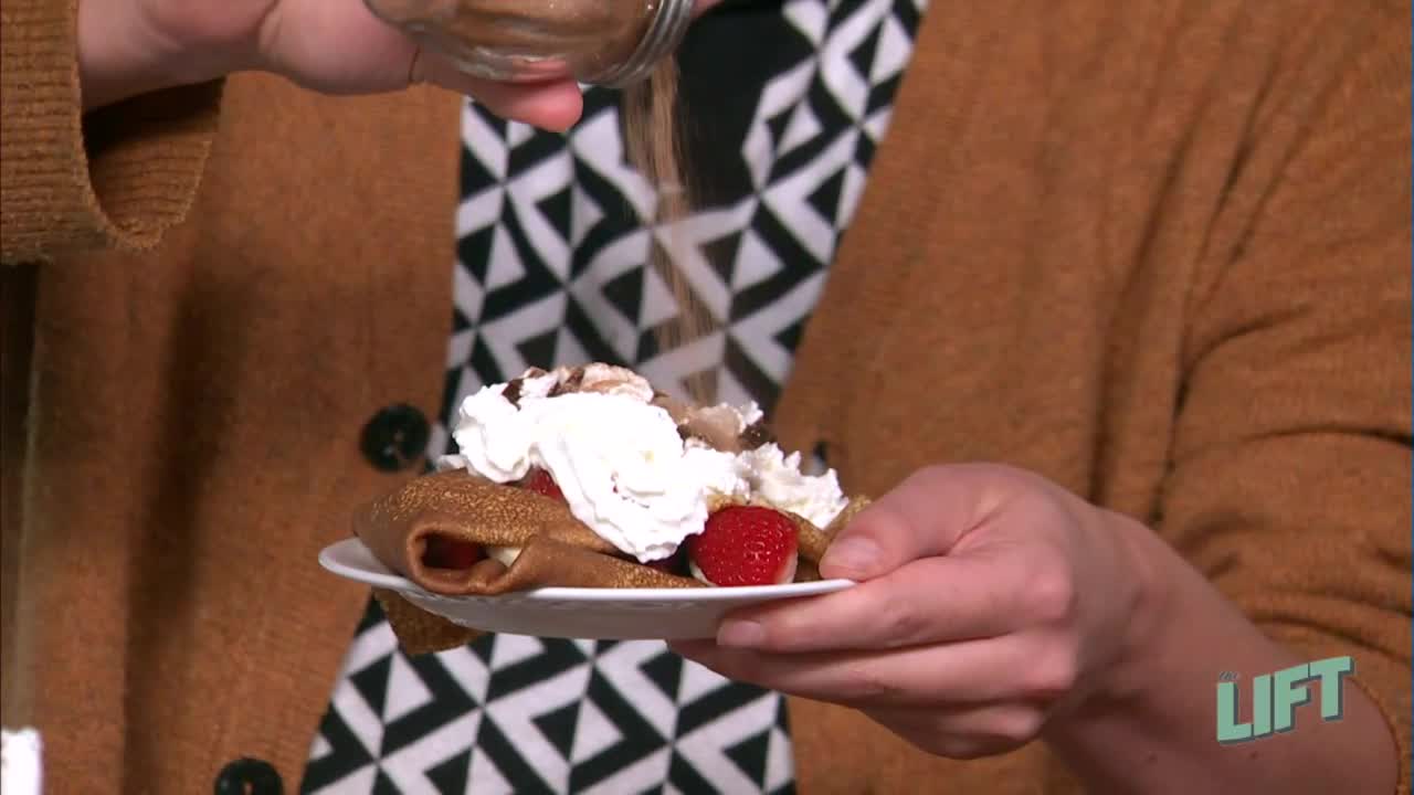 A sweet crepe with fruit and chocolate sauce