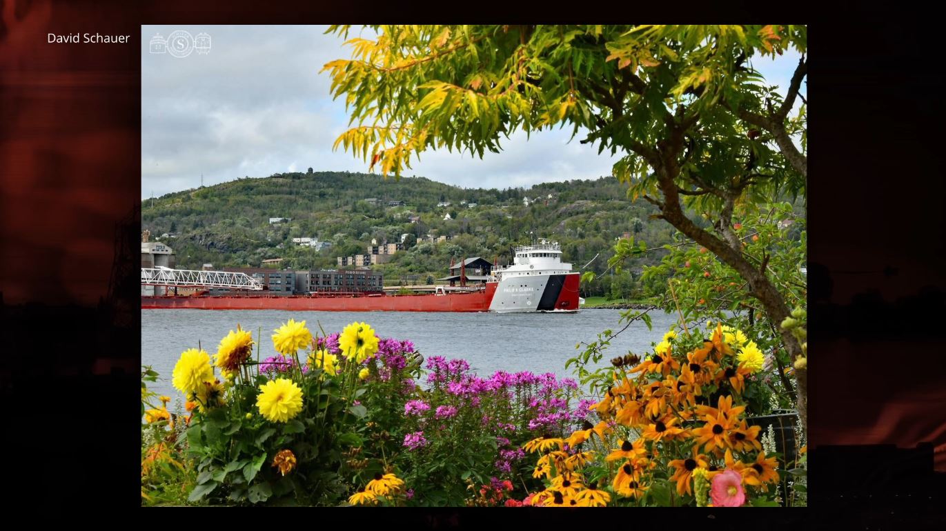 The Philip R. Clarke departs the port framed in flowers