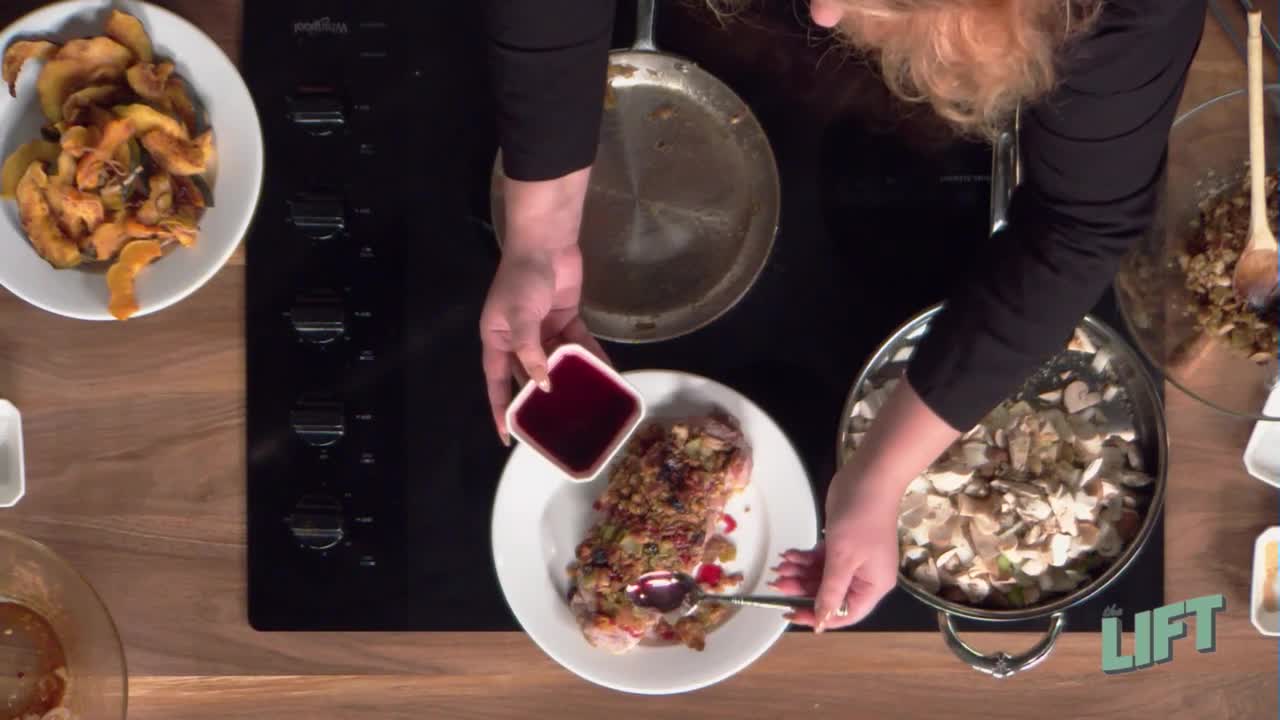 Beth spoons cherry sauce over the stuffed pork tenderloin