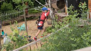 A boy on the ropes course at the North Shore Adventure Park