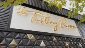 The sign above the door to the Tasting Room