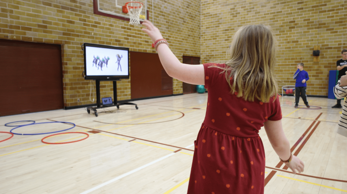 A Lester Park Elementary student participates in a dance warmup